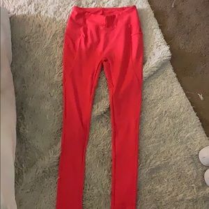 red gymshark leggings. size small